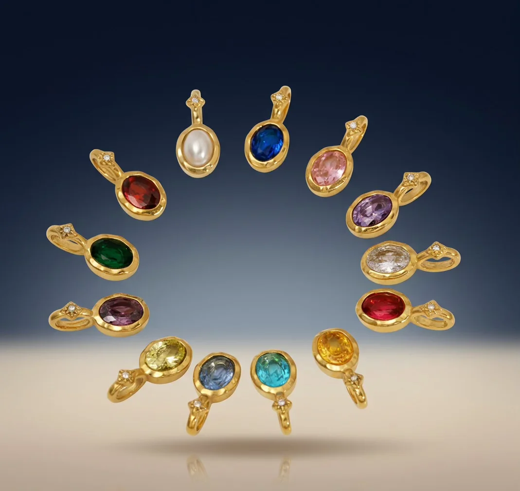 Gold charm pendants set with colored stones