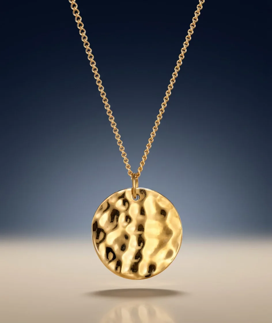 Hammered gold coin pendant on a fine chain